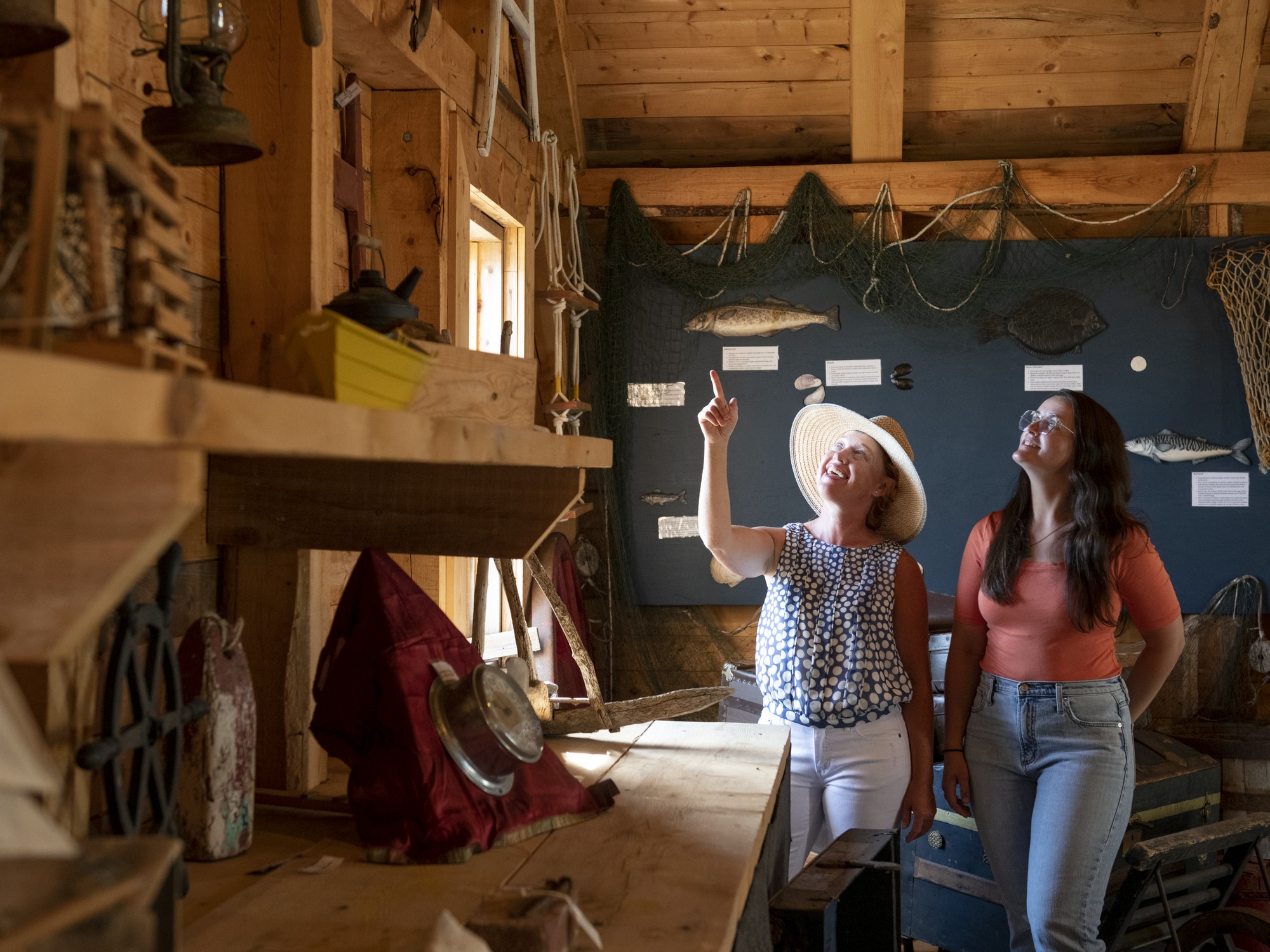 Two people visit LeNoir Forge Museum in D'Escousse, Nova Scotia