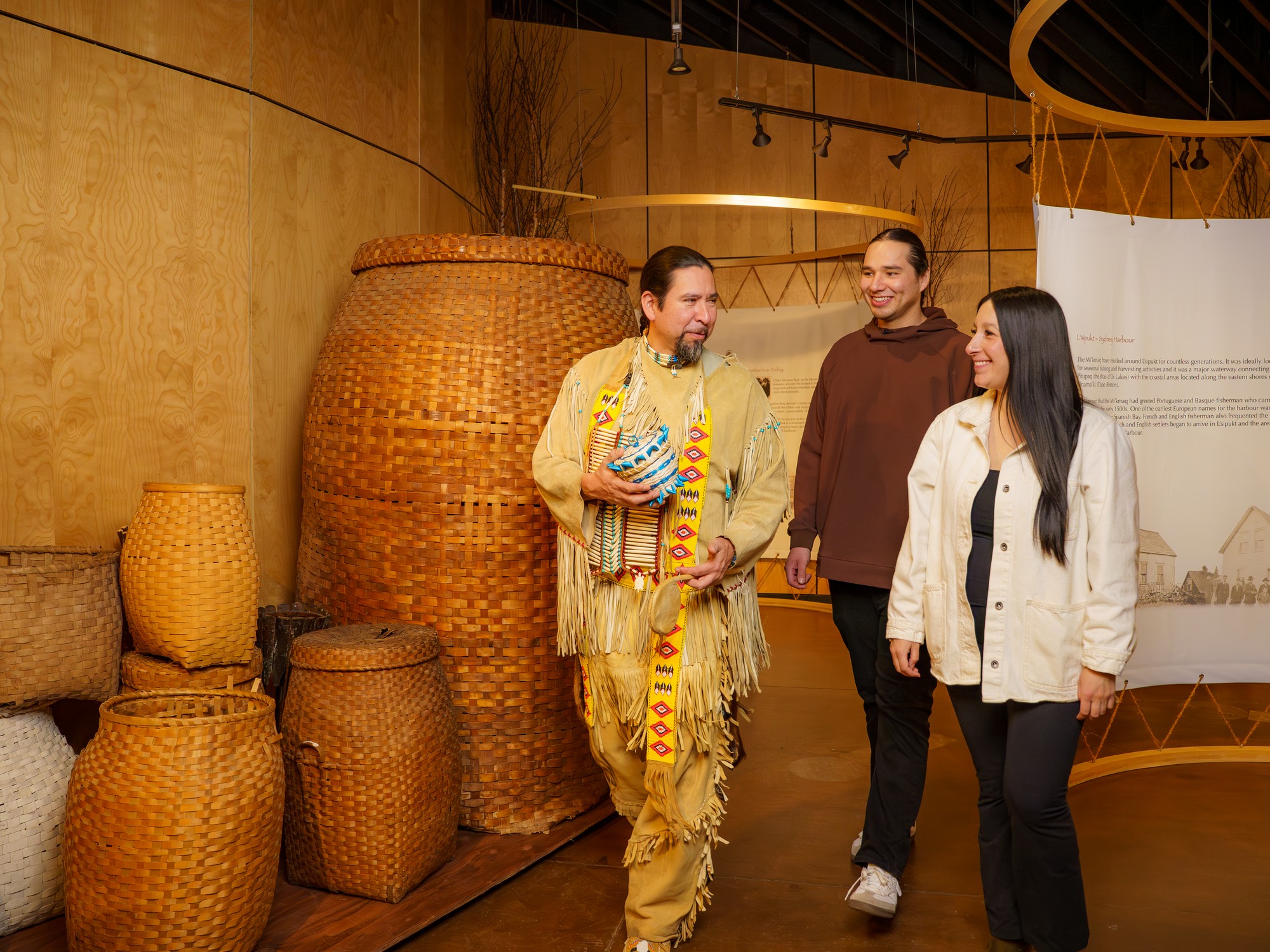 An interpreter at Membertou Heritage Park in Nova Scotia interacts with guests
