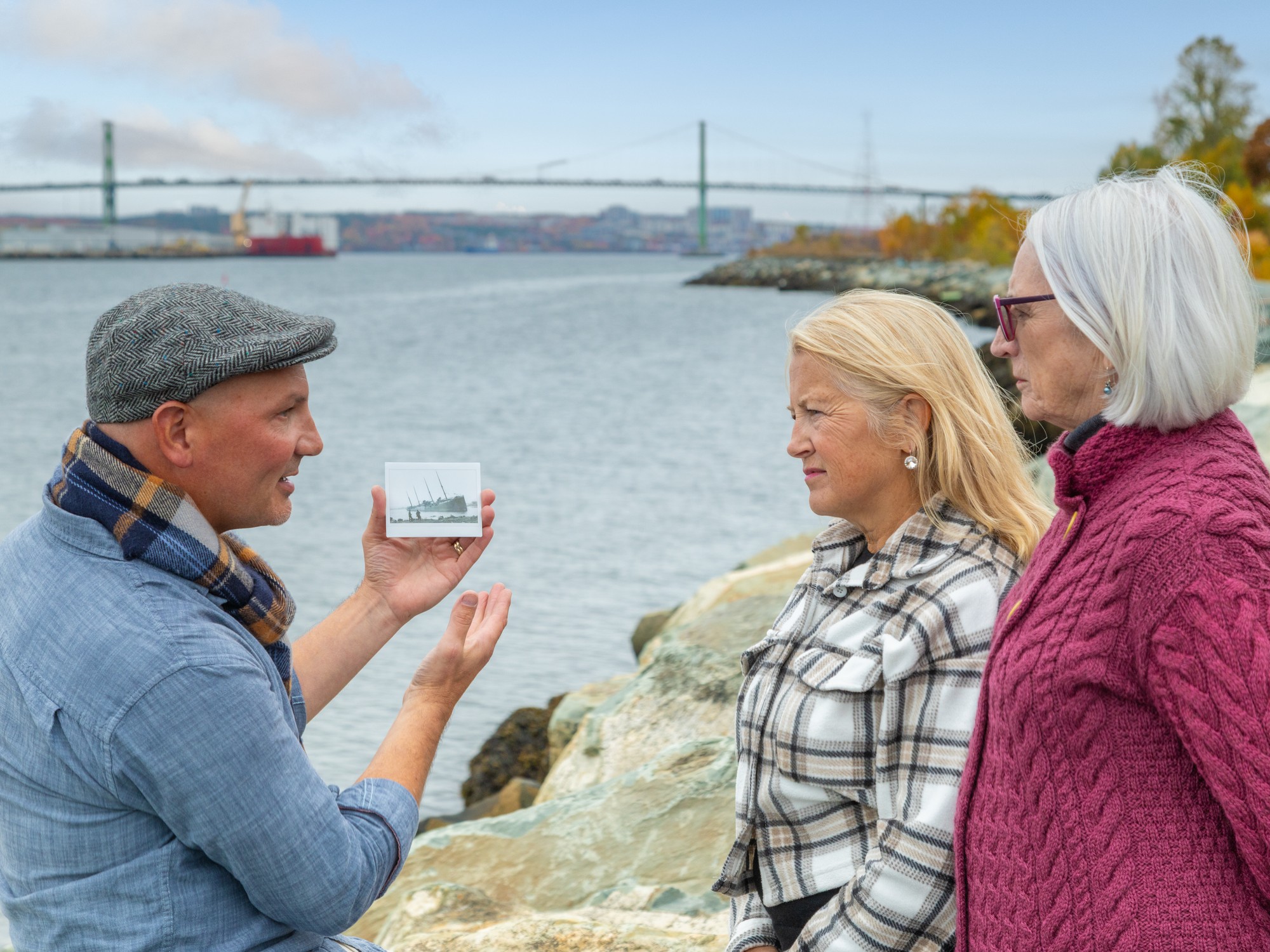 A tour guide shows a photo during a guided tour about the Halifax Explosion in Halifax, Nova Scotia
