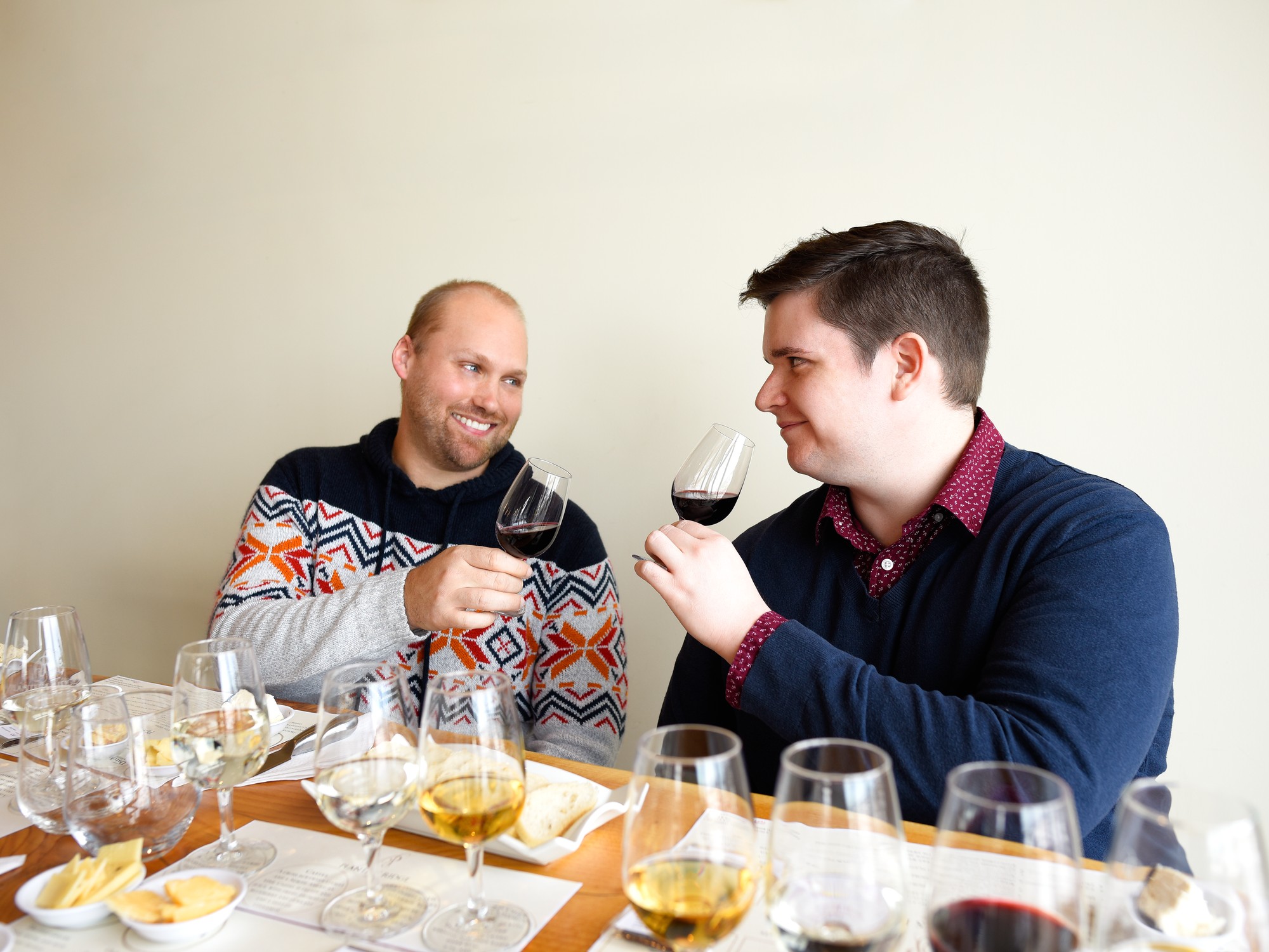 Two people taste wine at Planters Ridge Winery in Nova Scotia