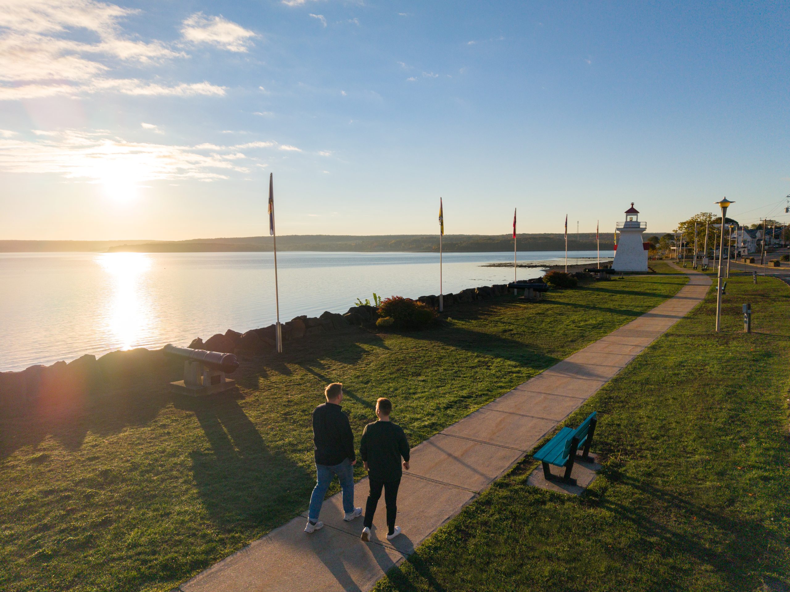 Couple walking on the Digby waterfront during the sunset